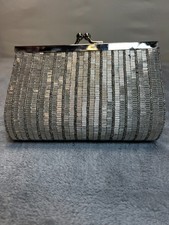 La Ragale metallic sliver clutch