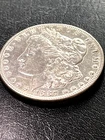 1887 MORGAN SILVER DOLLAR ALMOST UNCIRCULATED