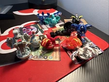 Lot of 12 Bakugan, 9 Cards and a Carrying Case