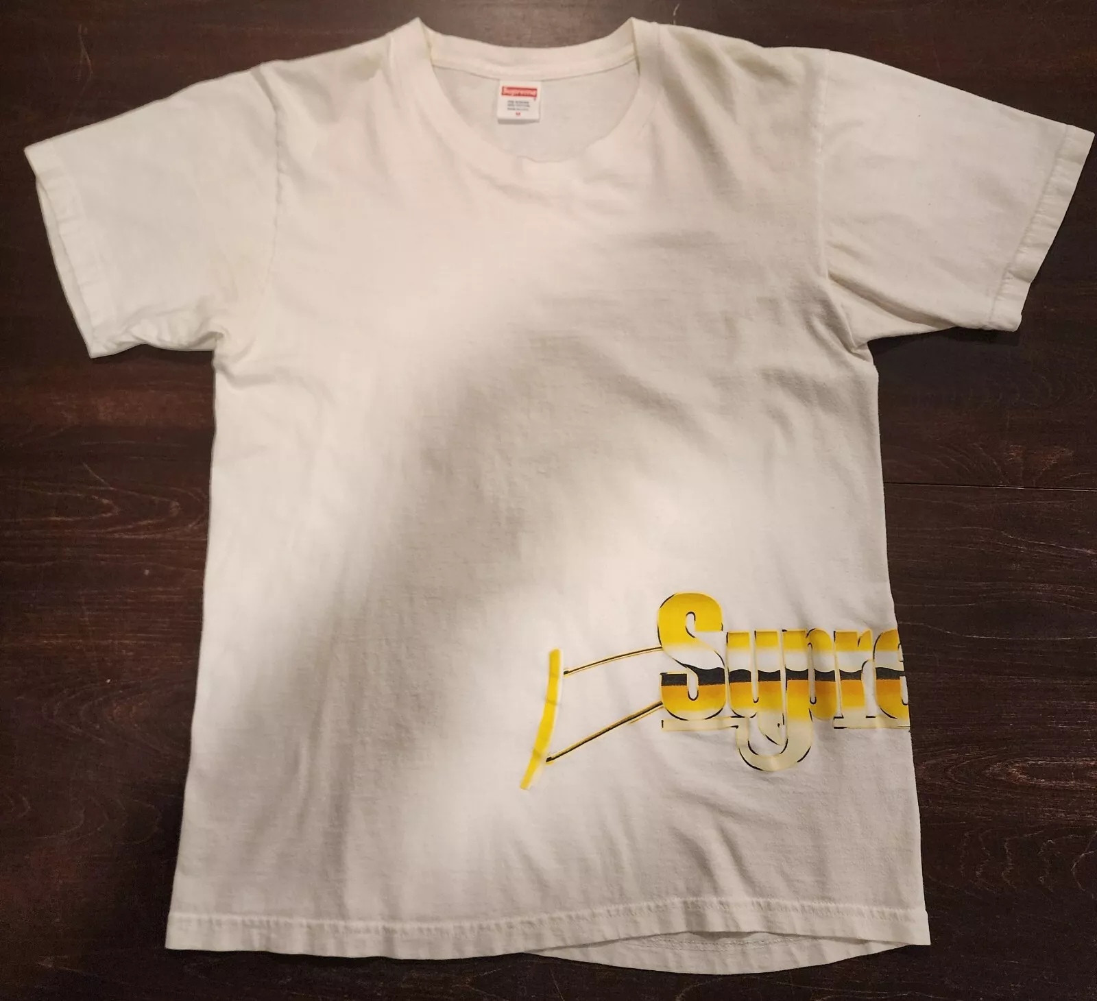 T shirt blanc suprême taille M logo pistolet doré graphique streetwear 