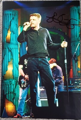 suggs MADDNESS lead singer singing a song on the stage signed 12x8 photo
