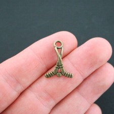 6 Hockey Charms Antique Bronze Tone Sticks and Puck - BC170