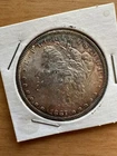 1887 morgen Silver dollar Toned BU