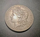 1879US Morgan Silver Dollar  =  BU