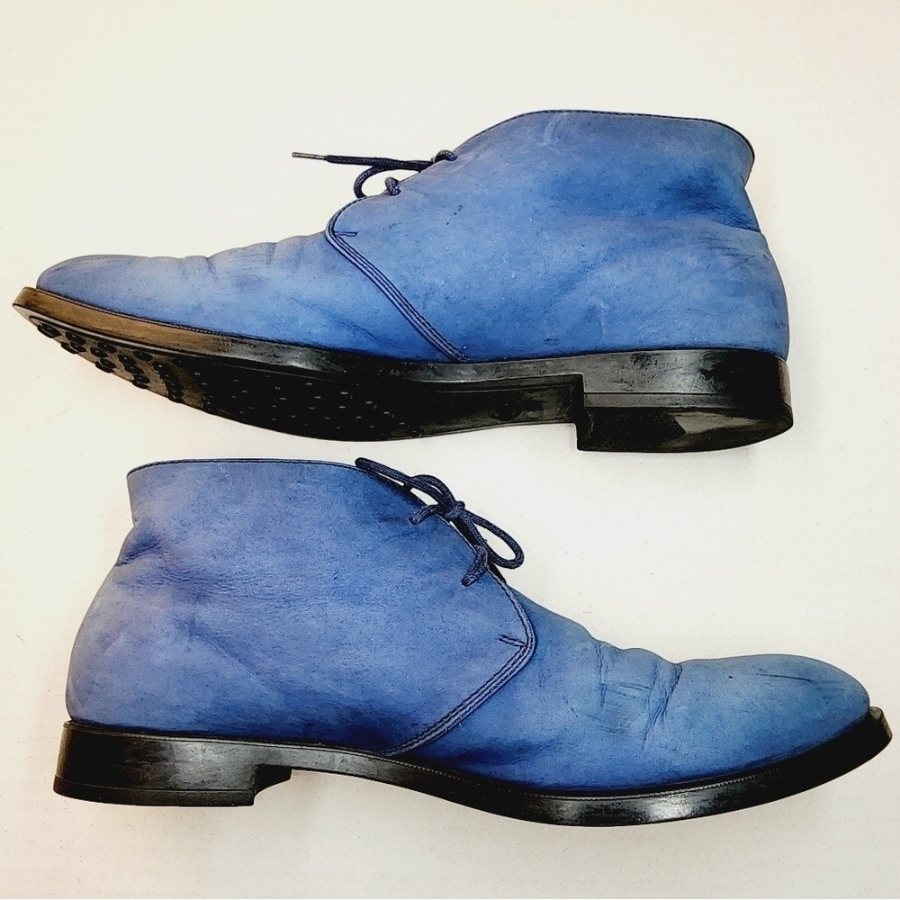 Pair of cornflower blue suede ankle boots with a low block heel.