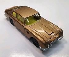 Vintage Husky Gold w/Yellow Interior Aston Martin DB6 1/64 Diecast