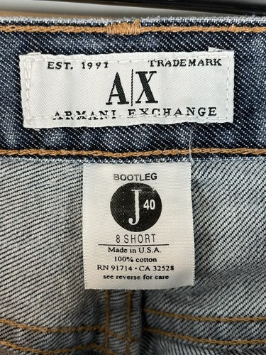AX Armani Exchange J40 women’s size 8 short regular bootleg jeans with faded blue denim and white label reading “Made in U.S.A.”