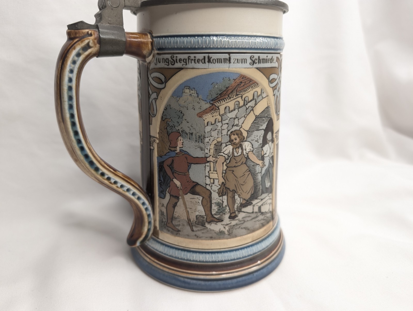 Mettlach Stein No. 2394. “Three Scenes from Siegfried's Youth" .5L, inlaid lid