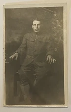 ANTIQUE PHOTO POST CARD SOLDIER SEATED RPPC Military