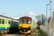 PHOTO  LEAMINGTON SPA STATION CLASS 150 DIESEL UNIT NUMBER 150115 IN NETWORK LOO