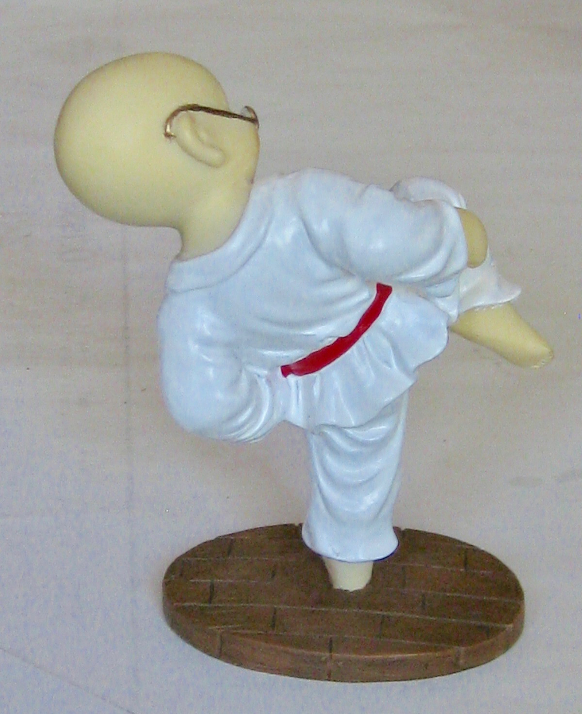 vintage Chinese ceramic karate kid figurine about 4 1/2" height, on