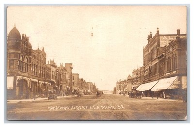 RPPC Albert Lea MN ~ Nelson bros Building on Broadway Street view