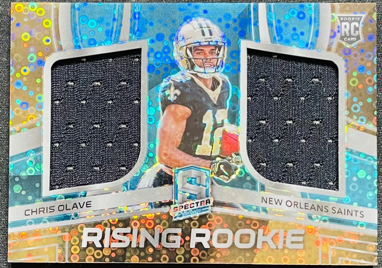 Chris Olave Panini Spectra Rising Rookie Materials #RRMCOL NFL Players Logo Laundry Tag Gold 1/1