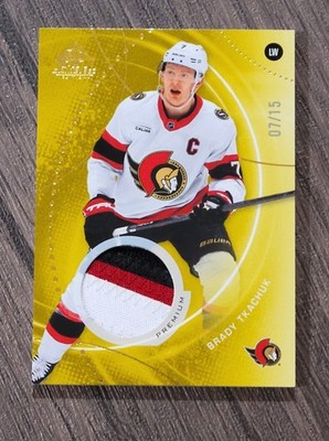 Upper Deck 2025-26 SP Game Used Gold Premium Memorabilia Brady Tkachuk #197 /15