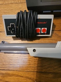 Nintendo NES Console Lot with 2 Controllers, 1 Zapper, 7 Games, and Cords