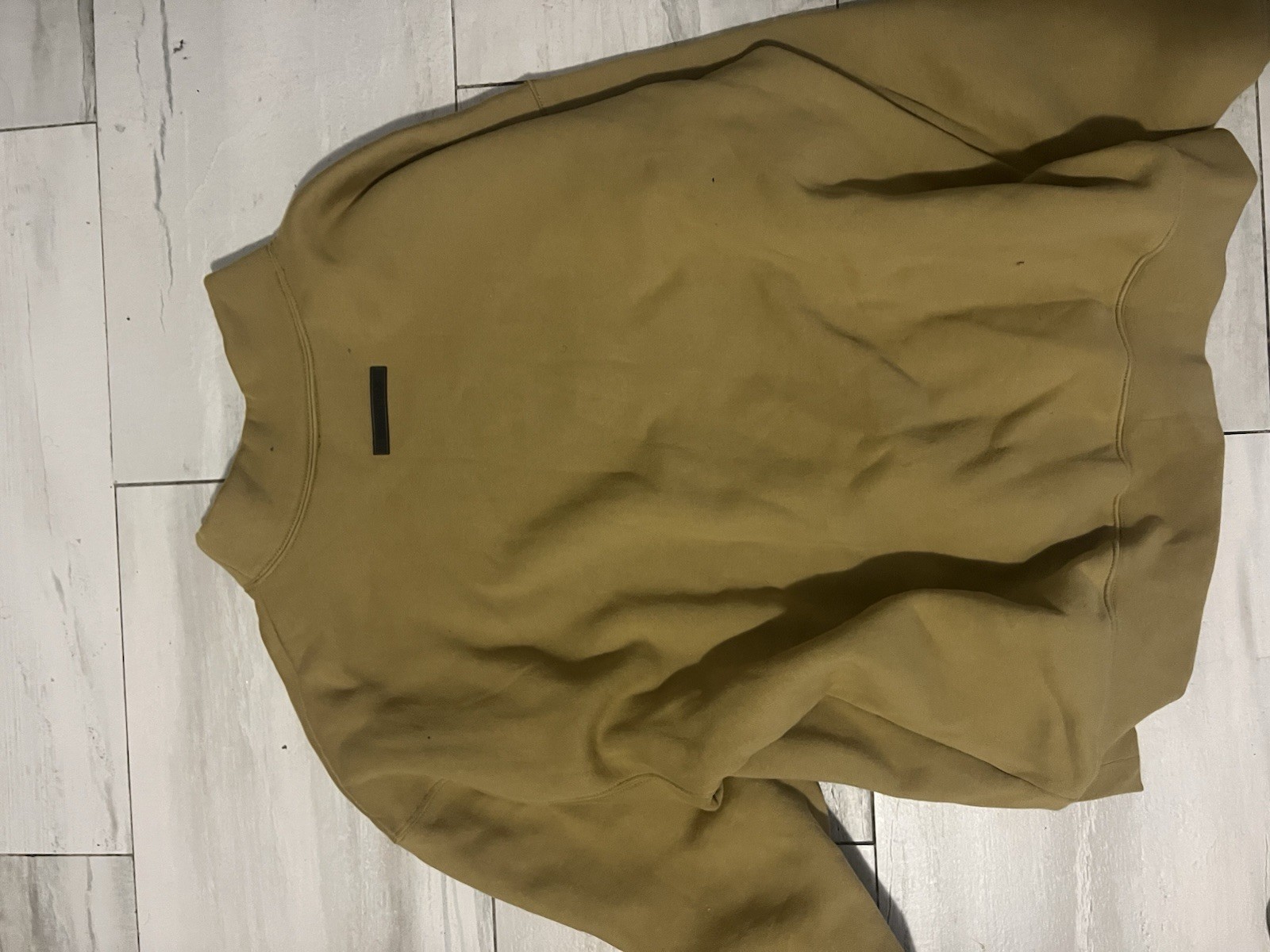 This is a Fear of God Essentials mock neck sweatshirt in an Amber Color. thumbnail 4