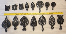 Lot of 15 Black Cast Iron Novelty Trivets, Assorted Designs.