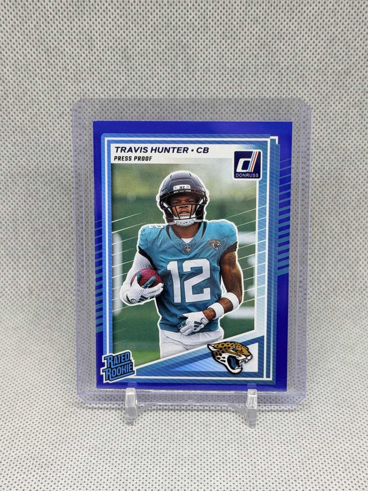 Travis Hunter 2025 Panini Donruss Rated Rookie Press Proof Blue #301 Jaguars