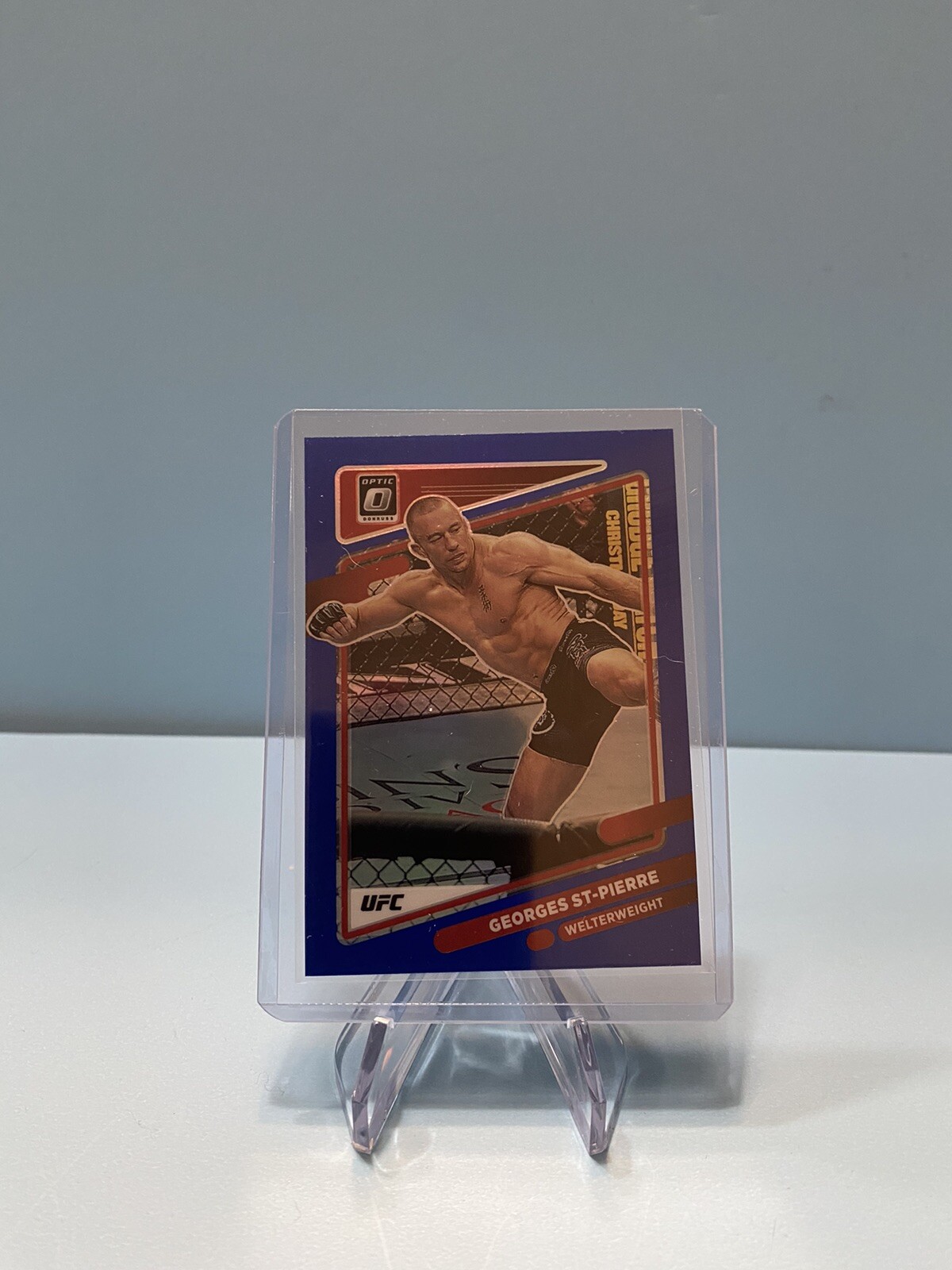 2022 Donruss Optic UFC #57 Georges St. Pierre Blue Prizm /99