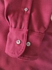 Filson virgin wool guide shirt with long sleeves, button front, and two white buttons on the cuffs.