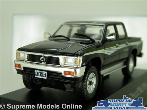 TOYOTA HILUX SR5 MODELL AUTO ABHOLWAGEN VAN 1997 SCHWARZ MASSSTAB IXO + HÜLLE K8 - Bild 1 von 4