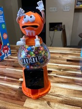 M M's Orange Plastic Candy Dispenser and Bank