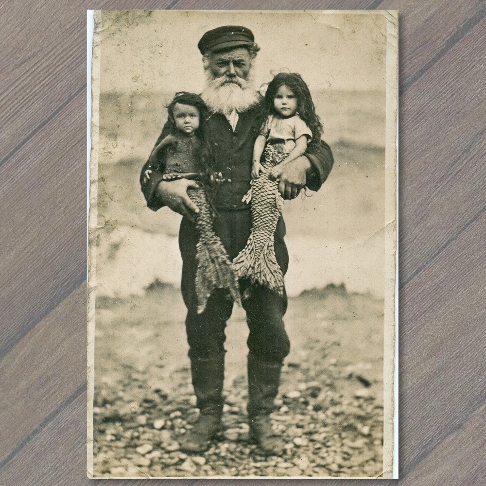 POSTCARD Old Sailor Bearded Fisherman Holding Two Mermaid Girls Beach Fantasy