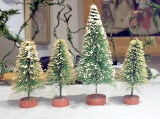 Four smaller Different Sizes Green Bottle Brush Christmas Trees.. Japan 1950s