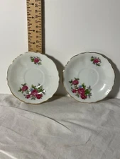 Two tea cup saucers with rose design JAPAN