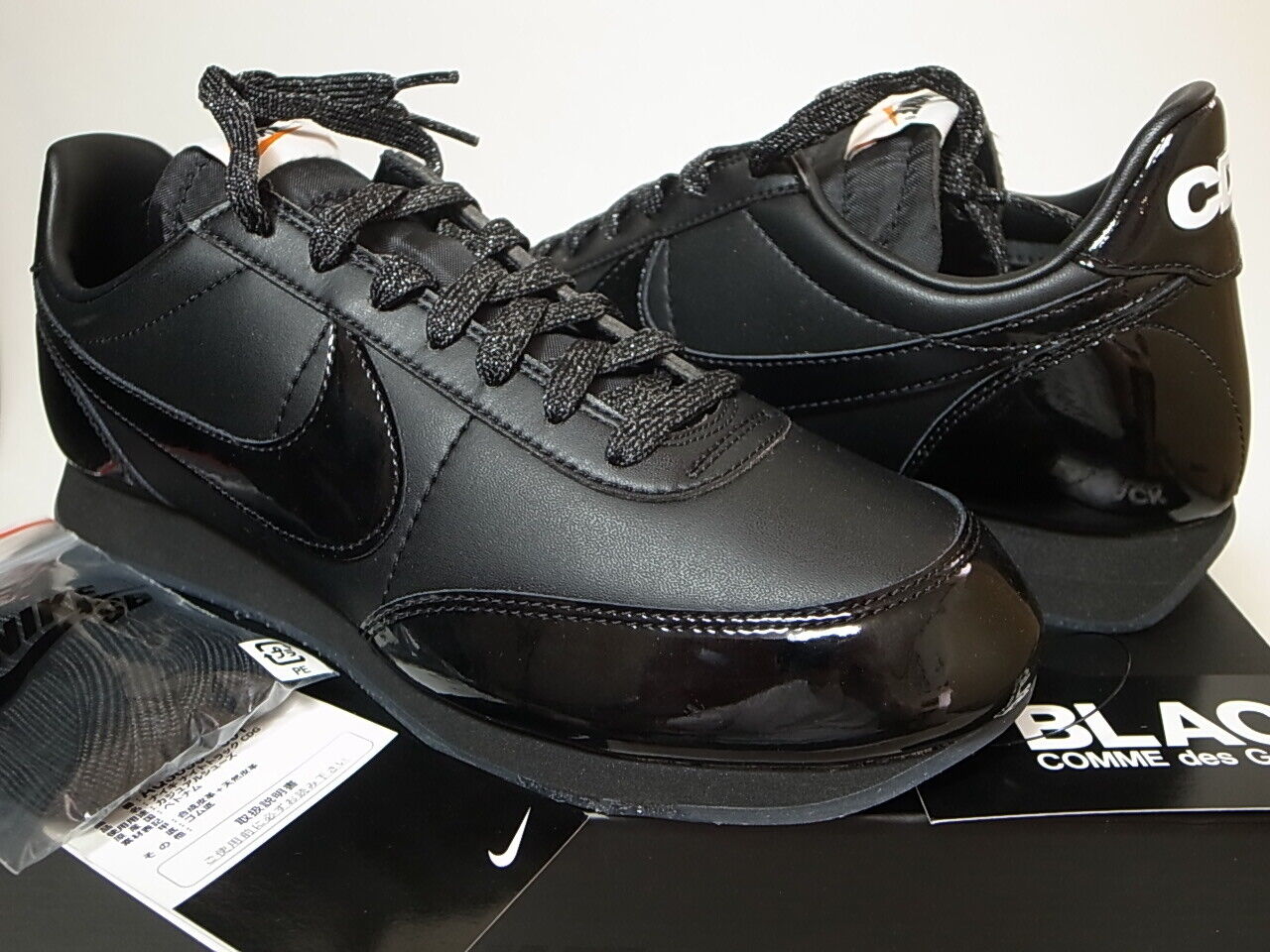 nike night track comme des garcons black