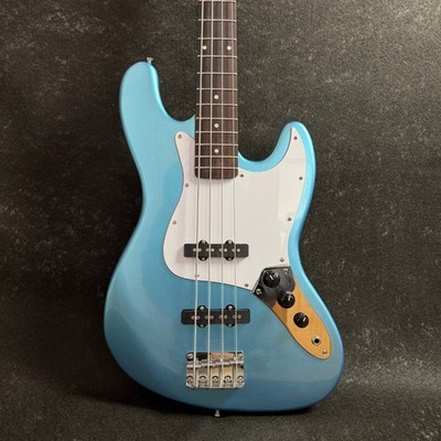 Blue bass electric guitar with 4 strings rock
