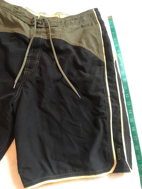 black and green swim trunks