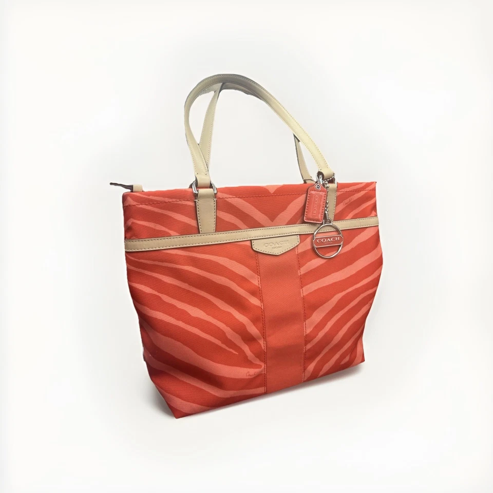 Bolso de mano/bolso de hombro Coach con estampado de cebra naranja