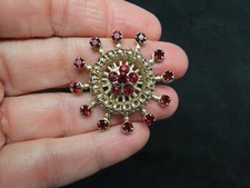 Vintage 1950's Gold Tone Filigree Red Rhinestone Burst Brooch