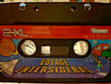 TIGER ELECTRONICS 2-XL TALKING ROBOT CASSETTE TAPE IN FRENCH VOYAGE INTERSIDERAL