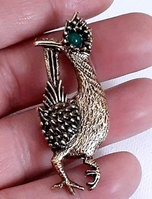 Vintage Ambassador gold tone Roadrunner Brooch/pin with green Cabochon bead eye