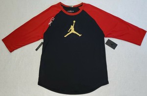black red and gold nike shirt