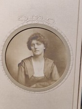 Vintage cabinet card a portrait of a lady by a female photographer .