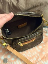 Pre owned excellent condition Louis Vuitton Mini Bumbag for women