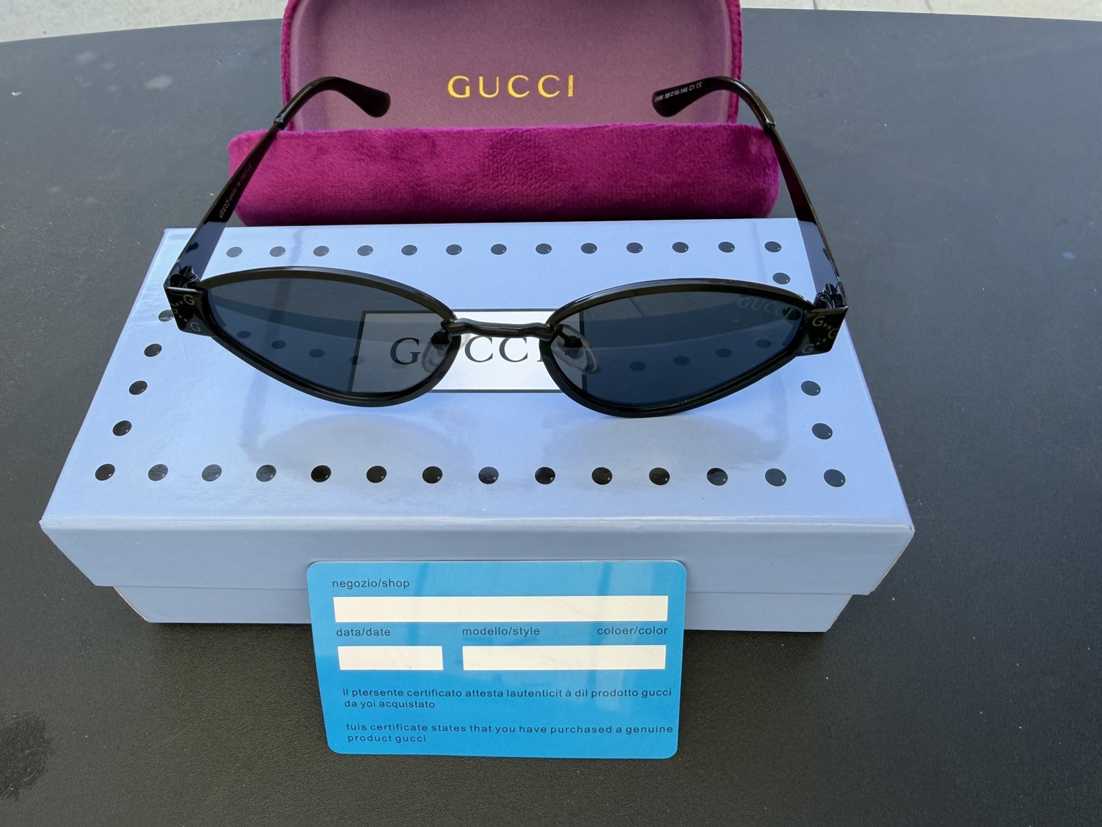 Gucci Women’s Oval Sunglasses Black Plastic Frame Gray Tinted Plastic Lenses
