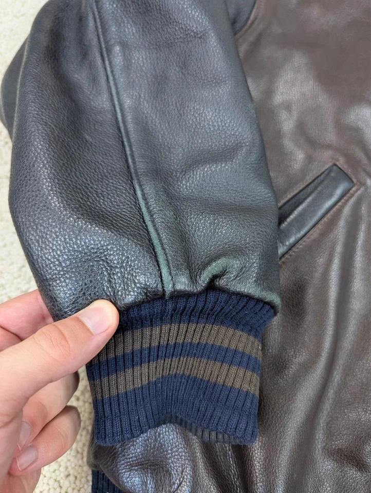 Chaqueta de cuero Roots para hombre mediana marrón negra abrigo acolchado de bombardero universitario vintage Foto 2 de 4