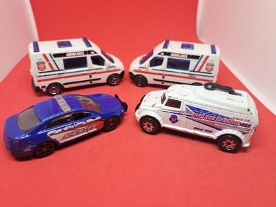 2 Matchbox Renault Master Ambulance Hot Wheels, Ford Interceptor & Robot Truck