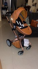 Hot Mom brown leather stroller with minor, barely noticeable scratches.
