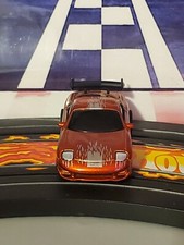 Autoworld Mazda Gold RX-7 On Tomy / AFX Chassis HO Scale Slot Car
