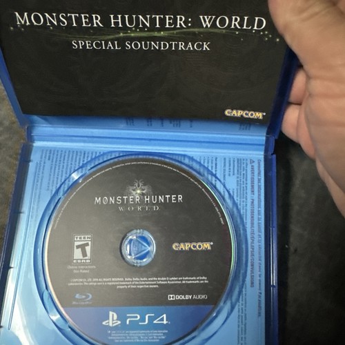 Blue PS4 case with Monster Hunter: World Special Soundtrack disc, Capcom logo, and ESRB Teen rating in white plastic case.