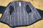 VTG Carhartt J01 BLK Detroit jacket with front snap pockets, red and gray vertical stripes, and white stitched collar.