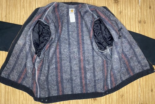 VTG Carhartt J01 BLK Detroit jacket with front snap pockets, red and gray vertical stripes, and white stitched collar.
