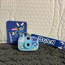 Disney Stitch Keychain - new one in bag/each click shows a new image on wall