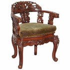 VINTAGE CHINESE RED LACQUERED CARVED ELM ARMCHAIR WITH HEAVY FOLIAGE DETAILING
