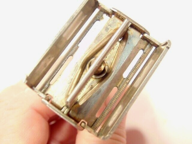 older Gillette safety razor;  marked X-4 on back of shaving head